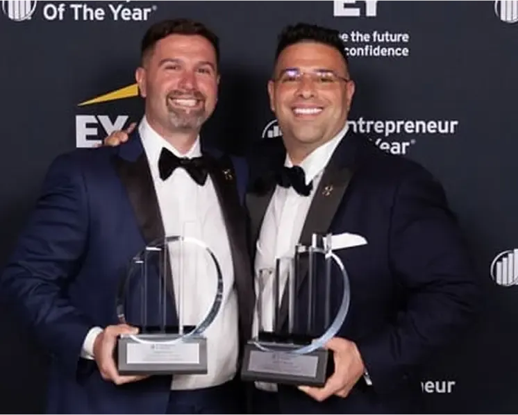 Two men with awards